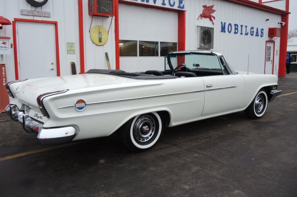 White 1962 Chrysler 300 convertible parked in front of a diner in Canada